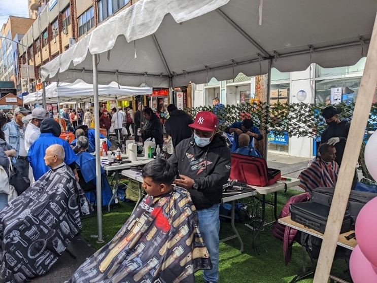 Queens residents receive haircuts