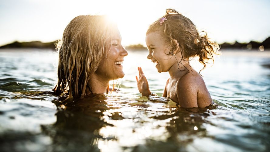 mother-and-child-swimming-in-ocean