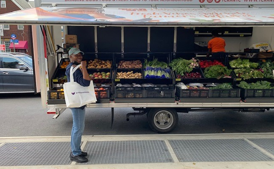 Woman shopping at farmer's market in New York City