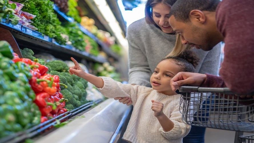 diverse family shops for vegetables