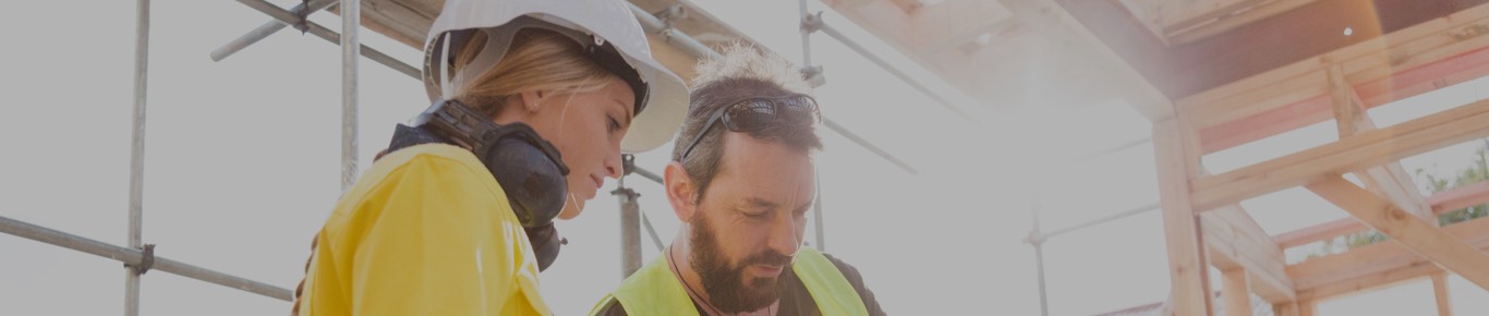 Man and woman on construction site.