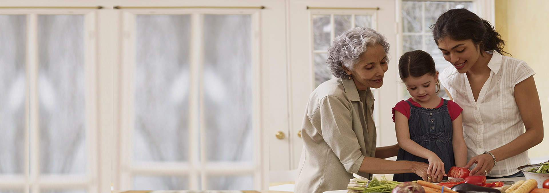 Three generations of women cooking