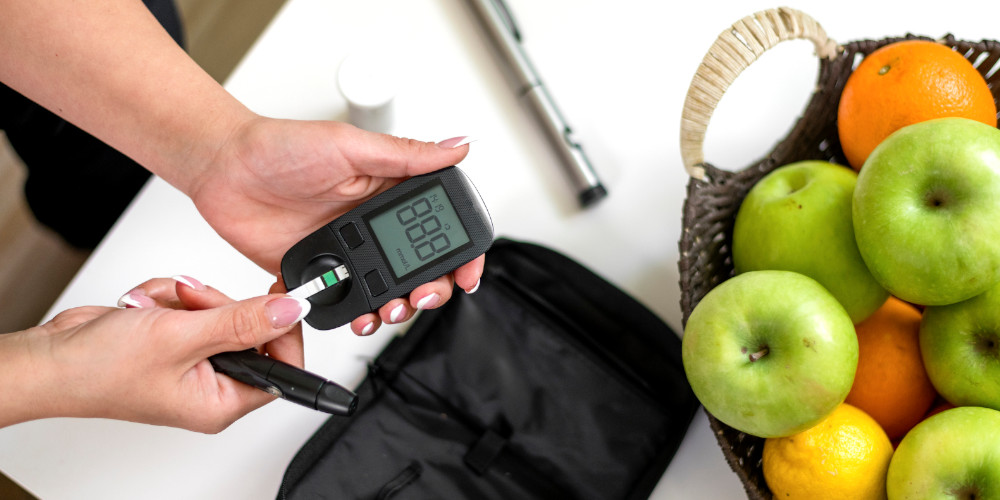 Diabetes patient checking glucose levels at home