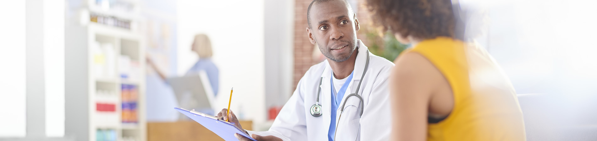 doctor discussing medication with female customer with checkout counter in the background