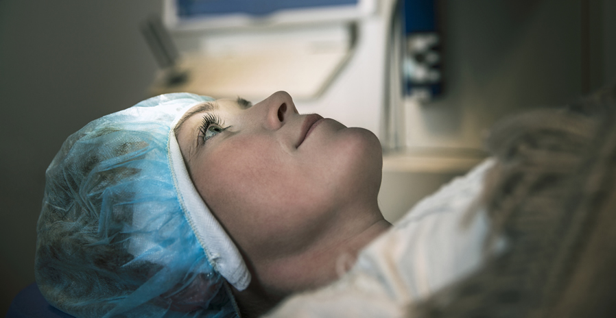 Female patient undergoing elective laser eye surgery