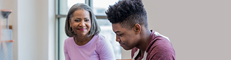 Mother and son are smiling and working on mental health