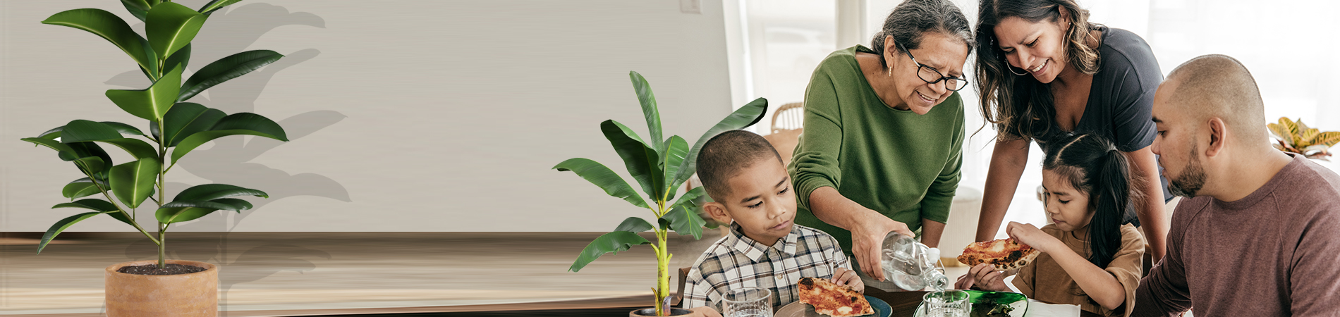 Multi-ethnic family having pizza