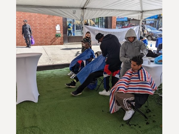 Brooklyn residents take part in receiving haircuts at the EmblemHealth Wellness Pavilion Tent (Source: EmblemHealth)