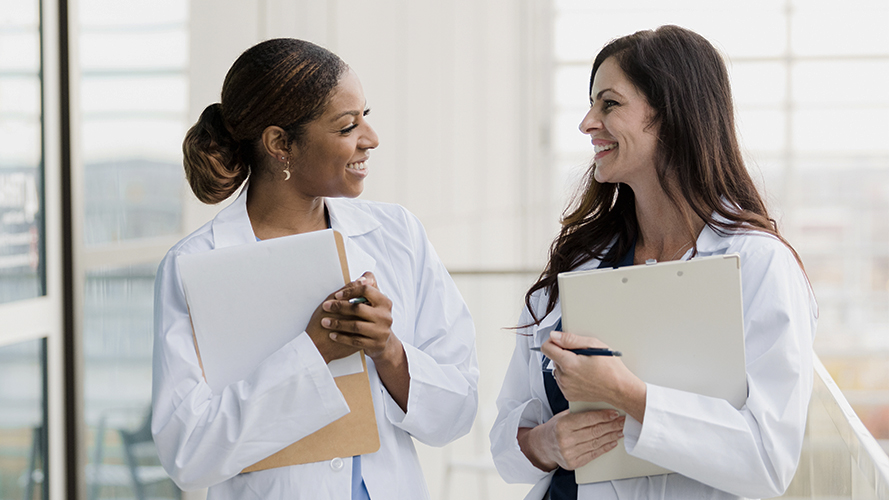 Female medical practitioner reassuring a patient