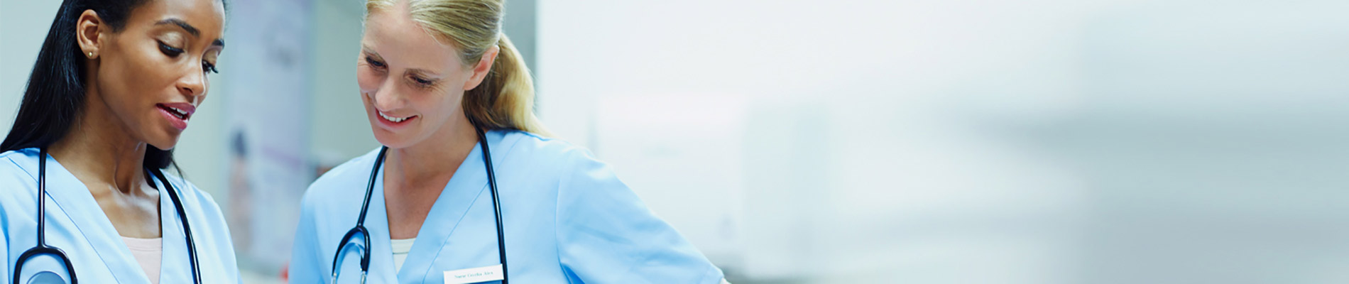 Two female nurses talking