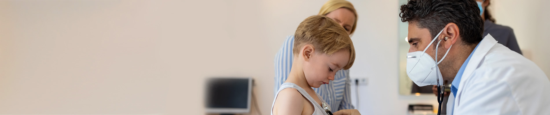 Doctor helping young patient