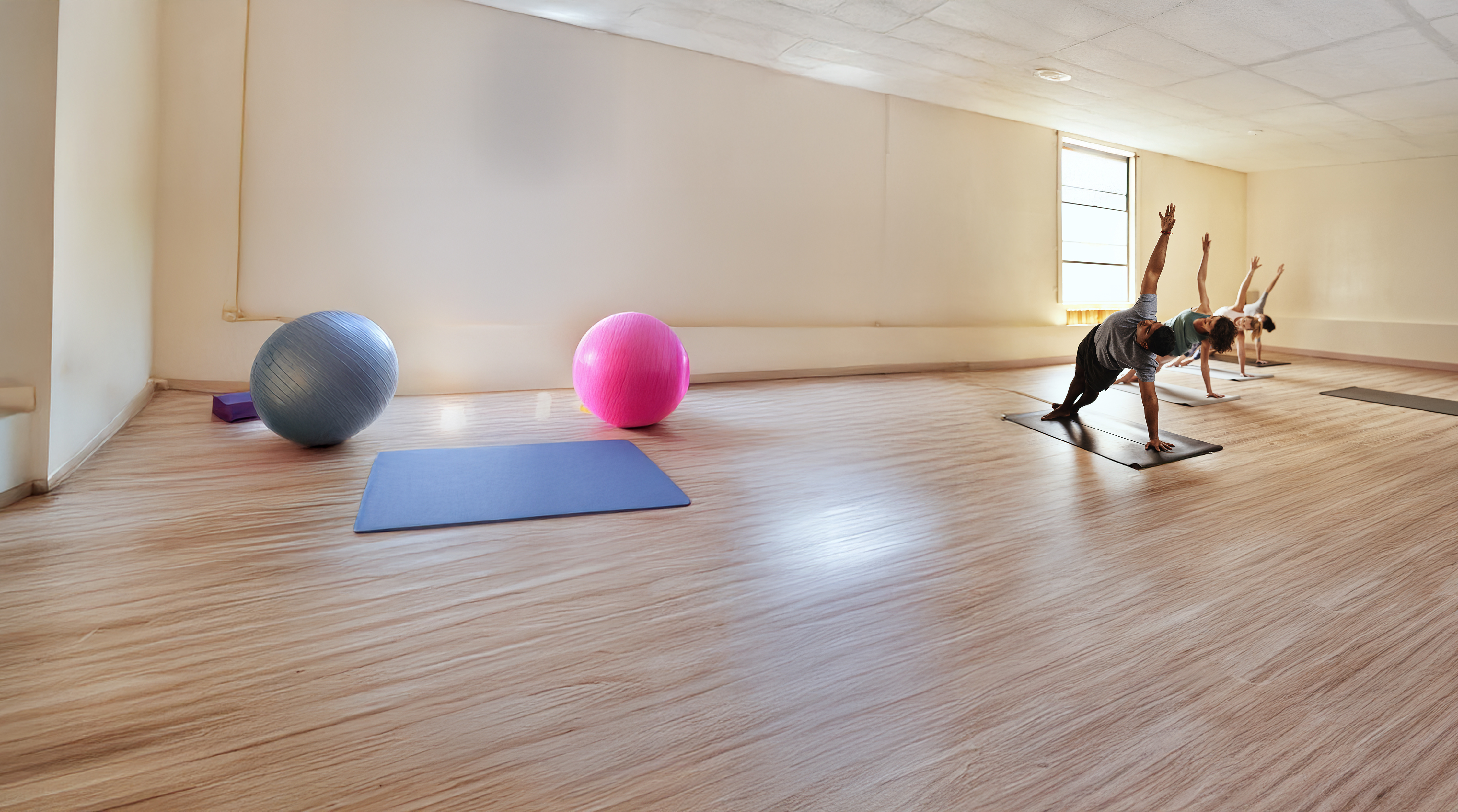 two people doing yoga outside