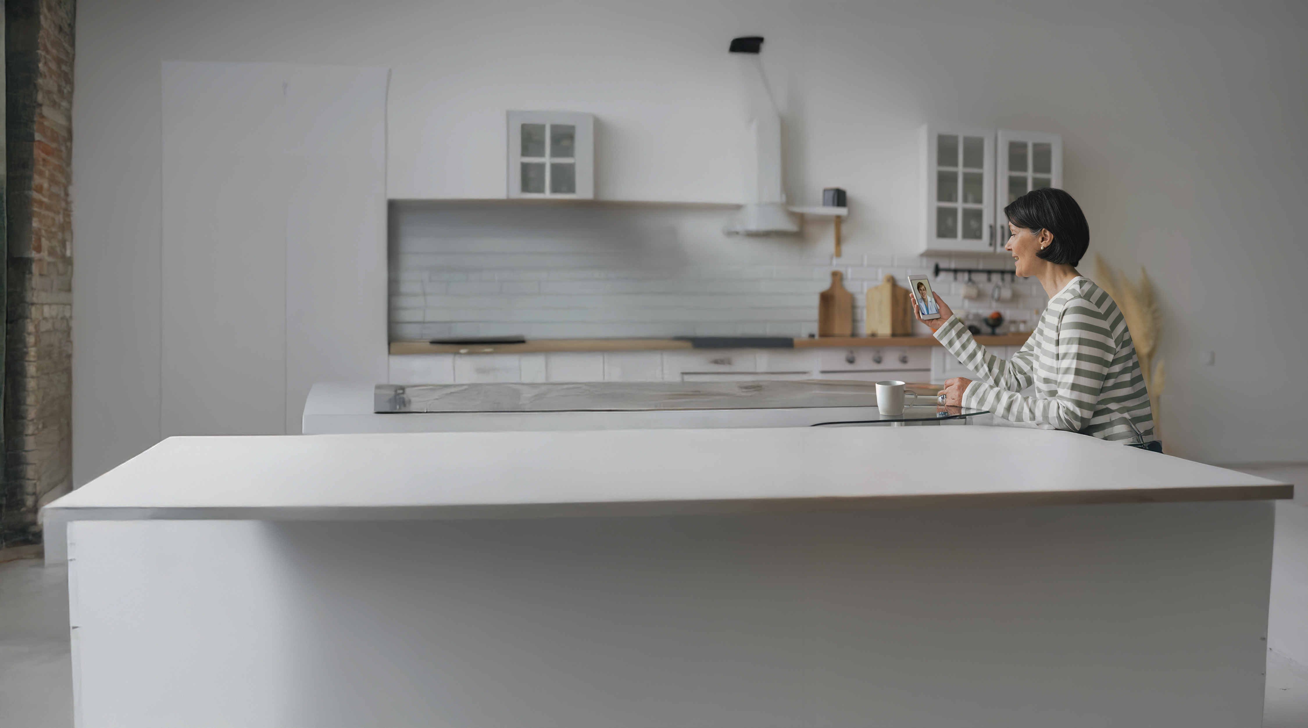 virtual doctor visit at home in kitchen