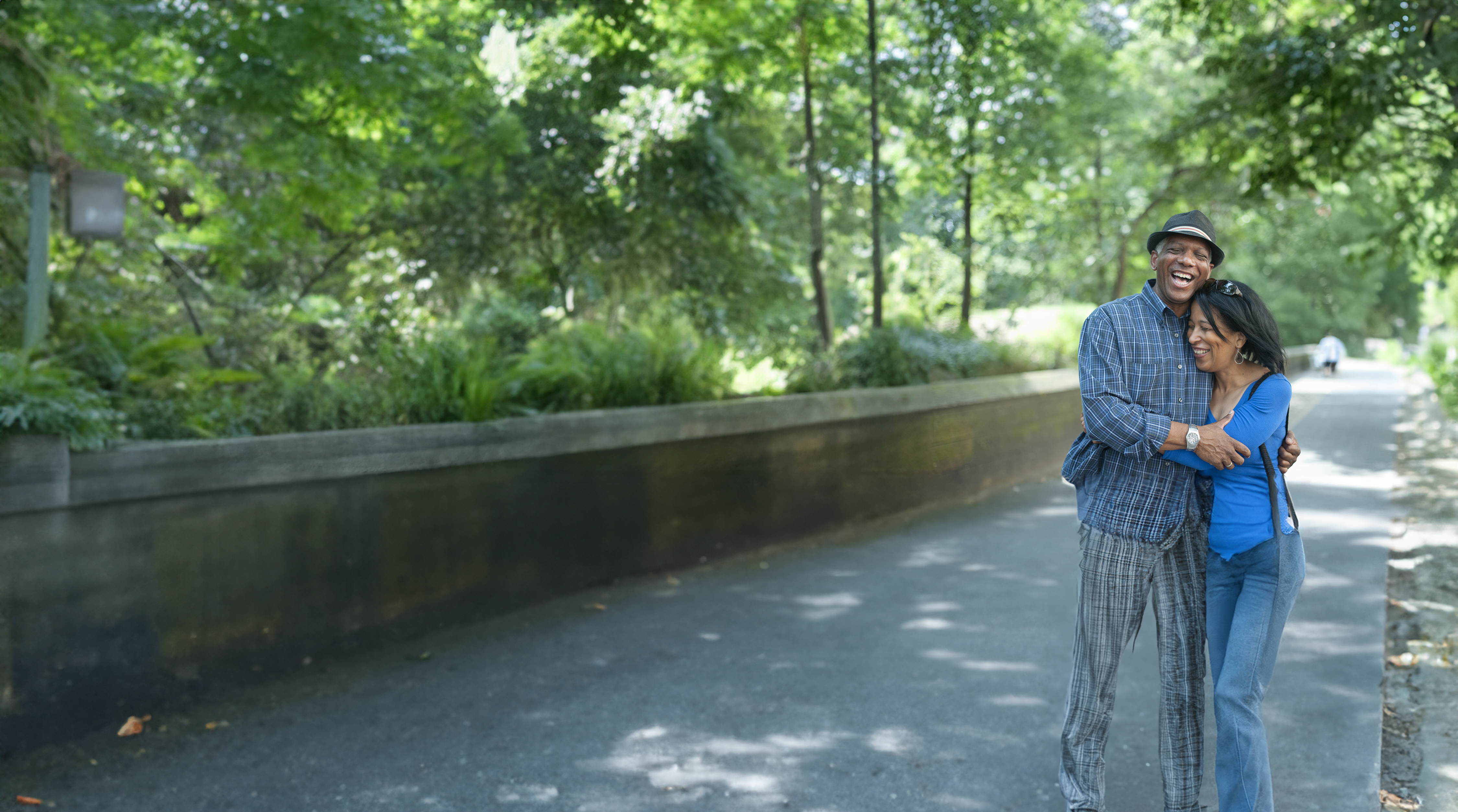 two people in park hugging