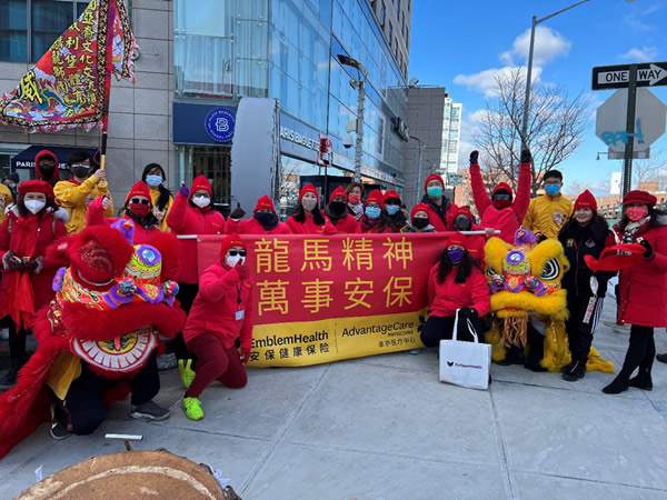 EmblemHealth and AdvantageCare Physicians of New York Volunteers with Lion Dancers gathered before the parade step off