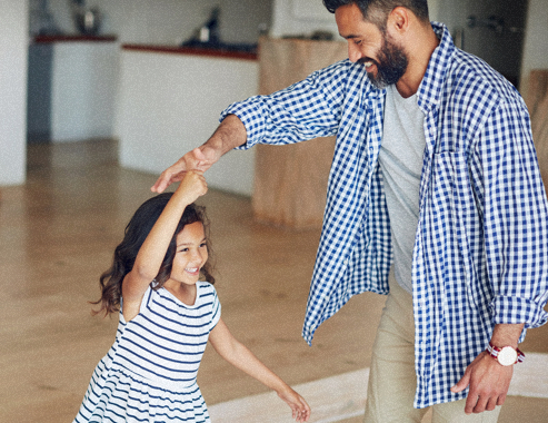 father dances with her child